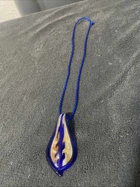 Blue Glass Flame Pendant Necklace with Gold Accents